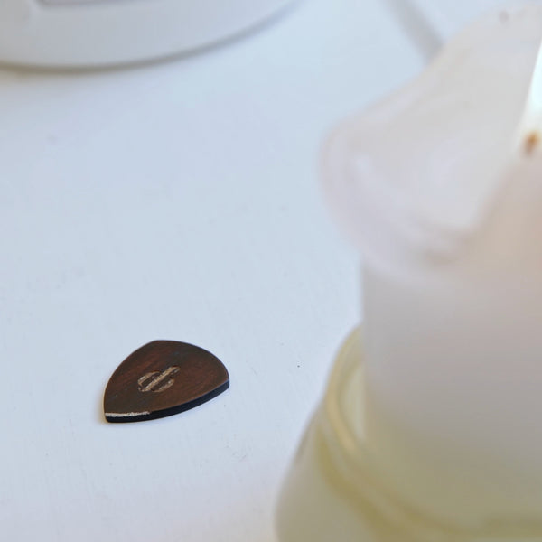 The journey comes full circle. Openhagen crafts a pick from the same mahogany tree as the guitar, so you strum with wood that shares its soul.