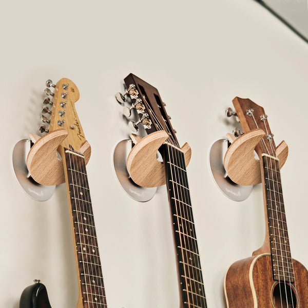 Guitar, electric guitar, or ukulele variants—each shaped for the right  headstock fit.