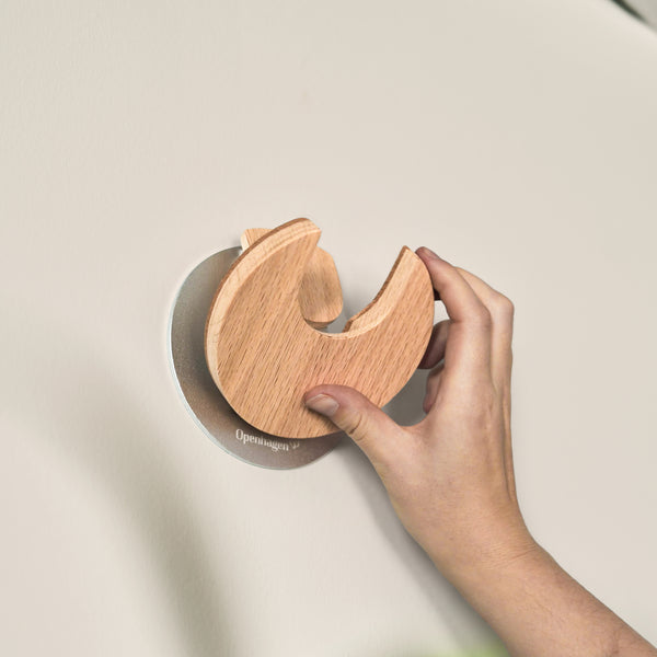 One motion. Secure hold. The easiest way to keep your guitar  accessible - without stands on the floor.