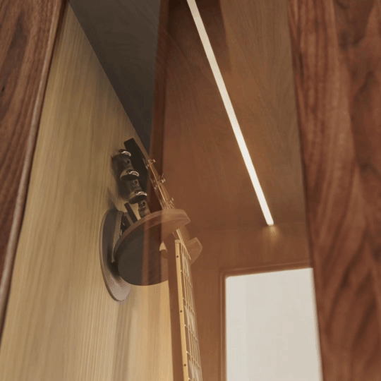 A light that responds to your presence, illuminating your guitar from front to side — designed to be seen, even when not played.